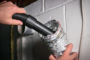 Cleaning dryer vent with vacuum